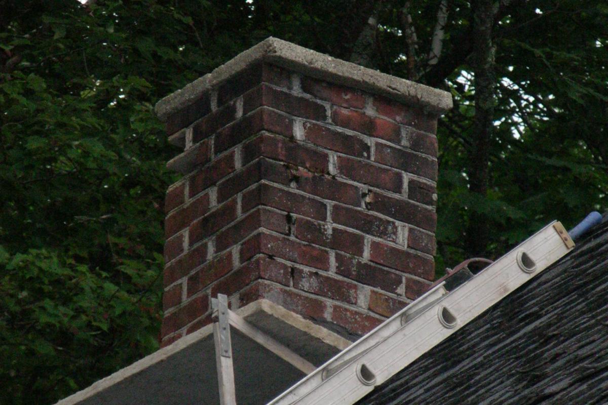 The chimney (with its metal flue liner and stone cap) is in fairly good condition, despite a couple of loose bricks that will be reinstalled.