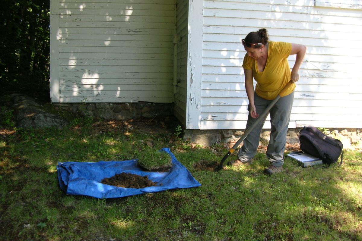 Buried treasure?  Historic archeologist Jessica Cofelice digs a small test pit...
