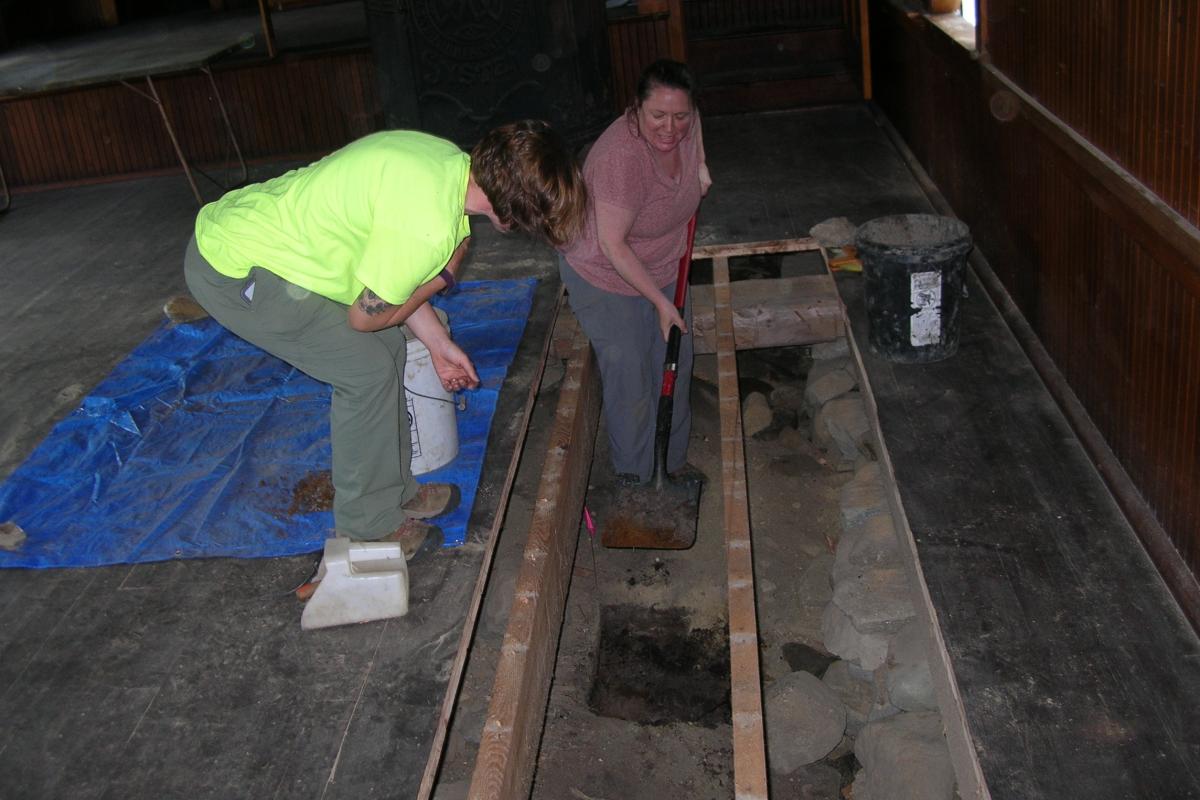 While digging the first test pit,  Jesse and Field Supervisor Emily Rux pause to examine some of the soil in the shovel.