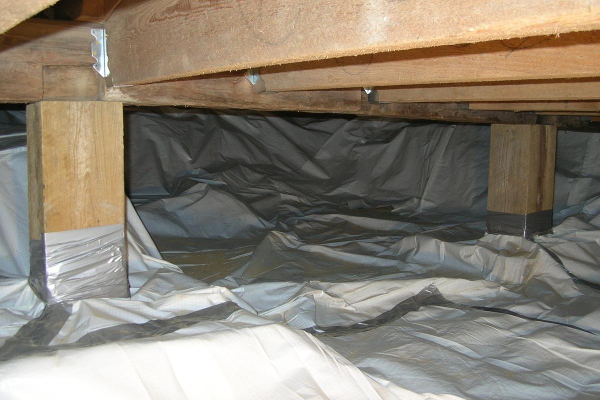 ...now shows the vapor barrier.  The vapor barrier extends over all of the foundation interior walls and covers the entire soil floor.