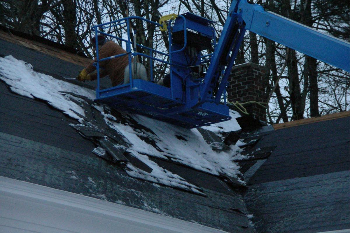 The old shingles come off along with the snow that fell over the weekend.