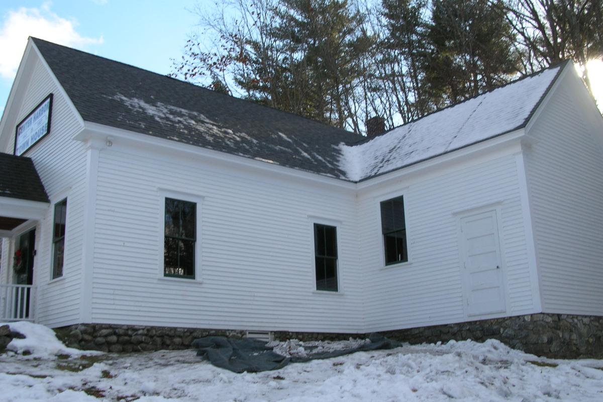 A little warmer weather and the sun have melted the snow off the new north roof, but snow still covers the new woodshed roof.