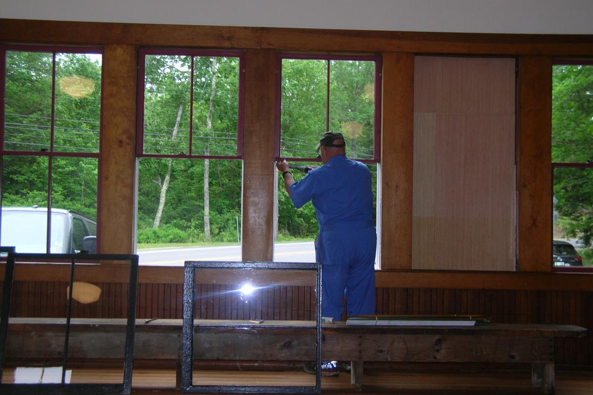 Weatherstripping is being installed before putting refurbished sashes back in place.