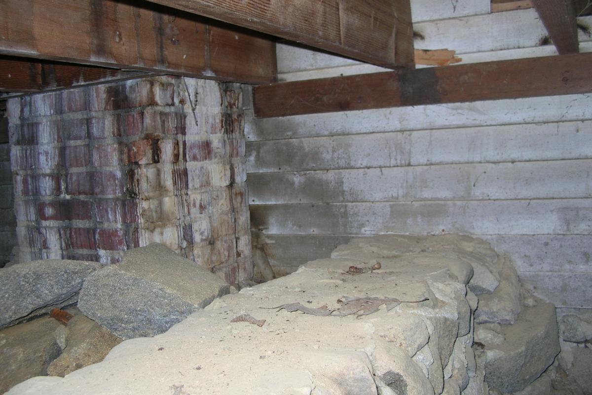 Rare glimpse into the crawlspace underneath the 1933 privies addition.  The indoor privies were added so the Town House could be used as a school..